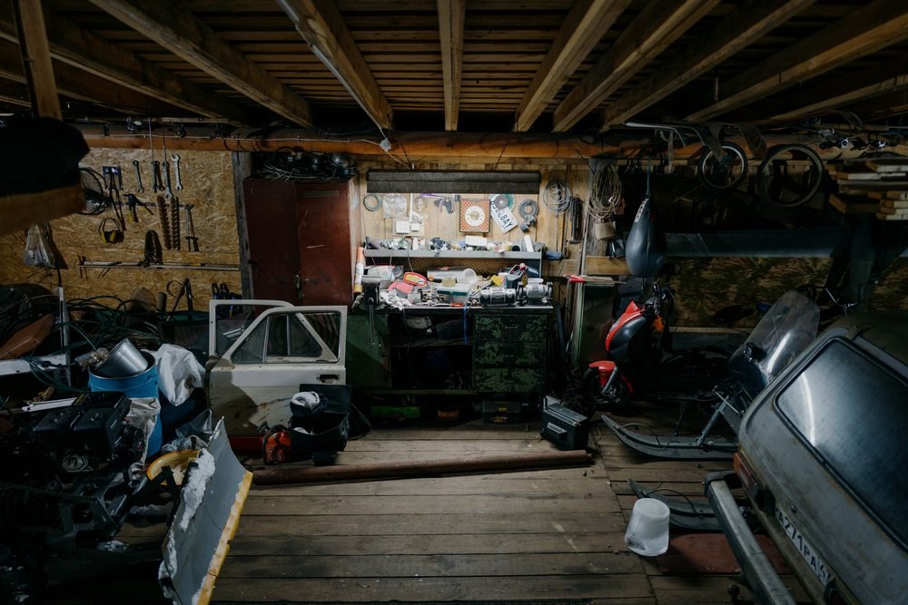 Garage workshop with stored tools and vehicle parts