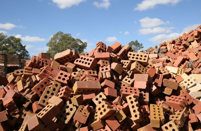 Heap of discarded broken red bricks